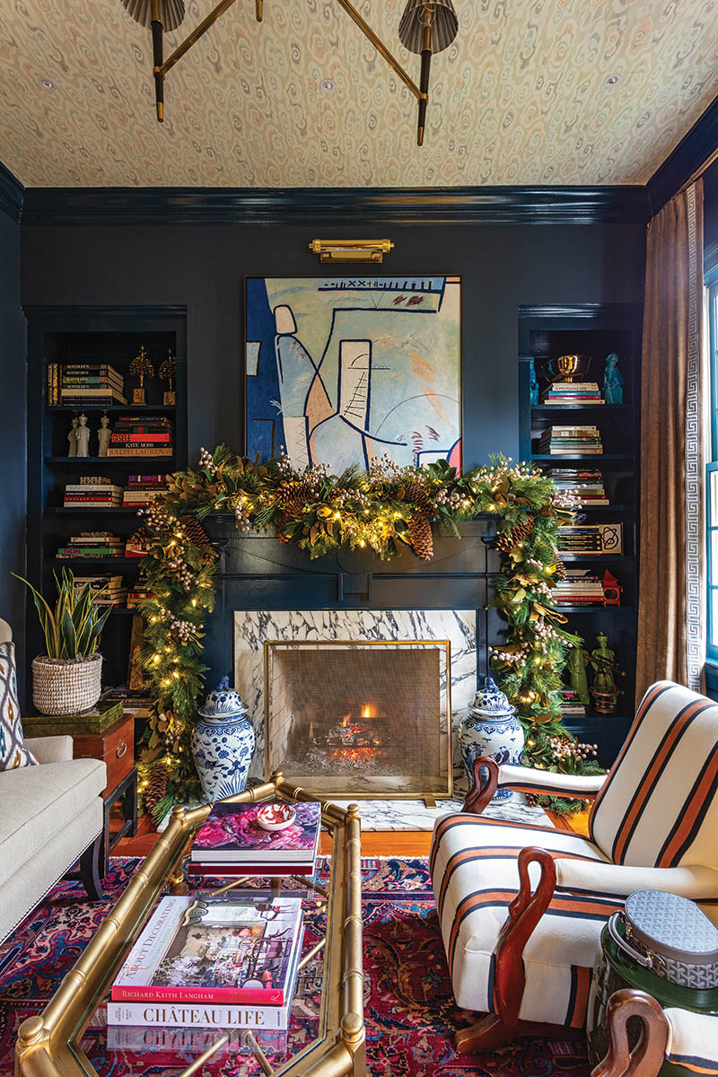 With the help of his mom, John builds all of the garland, dressing up each artificial base with decorative sprays, picks, and stems of all stripes. This room features the likes of magnolia leaves, pinecones, and berry picks sourced mostly from Winward Home and Natural Decorations Inc.