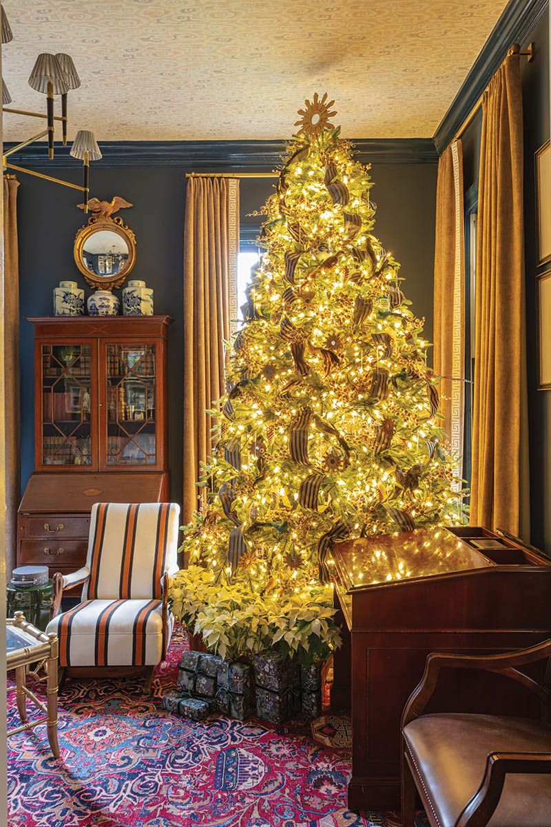 This large, formal tree is home to a collection of Palmetto State-related ornaments that John’s late grandfather, Hugh Leatherman—a state senator for 40 years—sent out to colleagues, constituents, and relatives every Christmas. Positioned among festive feathered birds and a different hue of interwoven ribbon each year, the fusion of old and new is striking (and fitting in a room that places antique furnishings alongside abstract art).