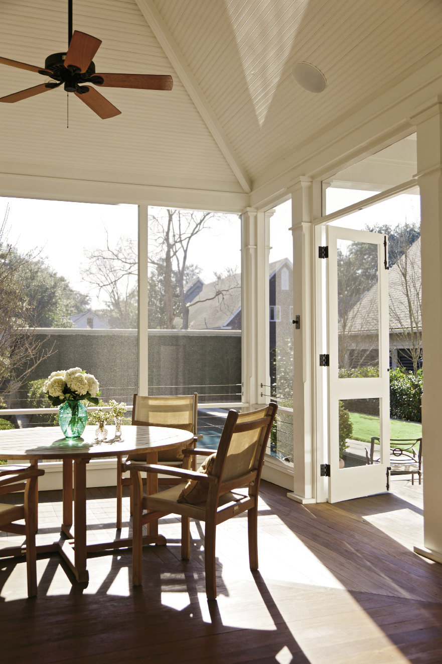 Two porches along the back of the home overlook the personal haven.