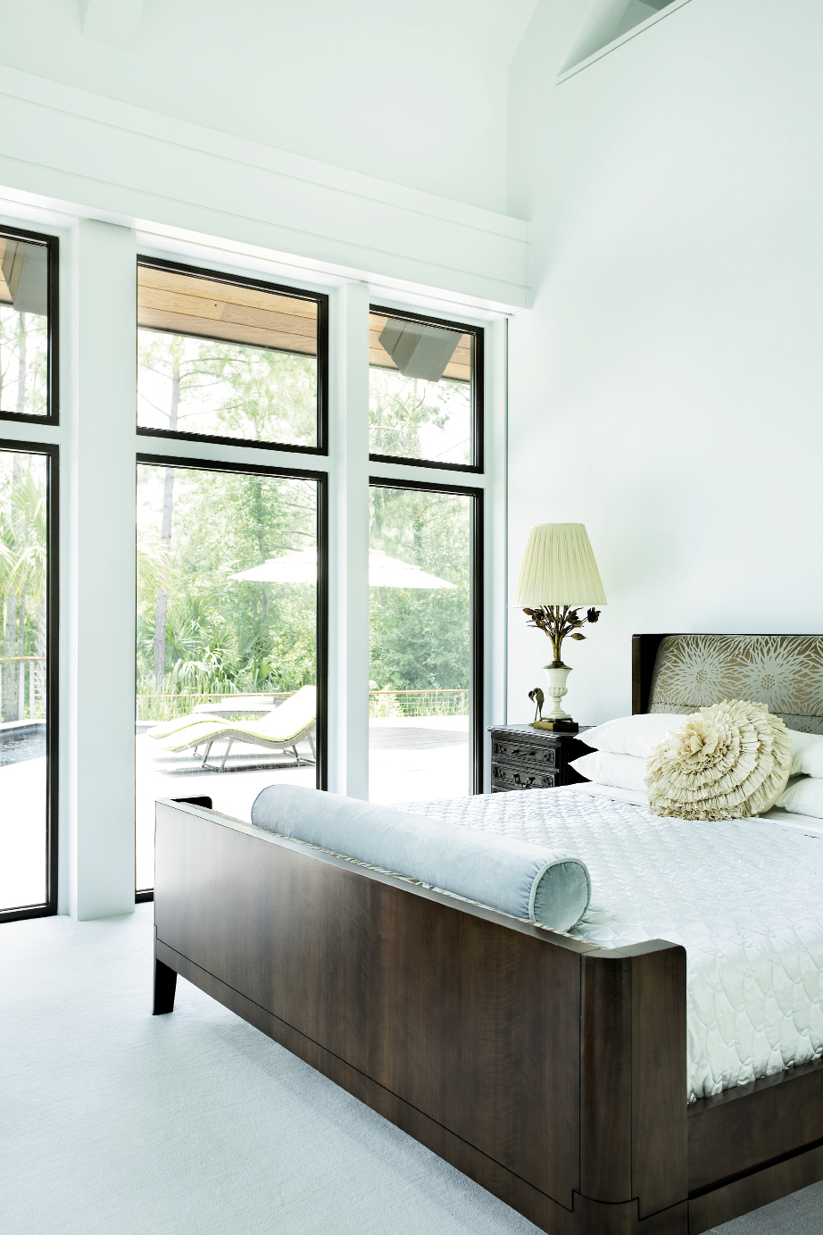 the master bedroom steps out to the pool