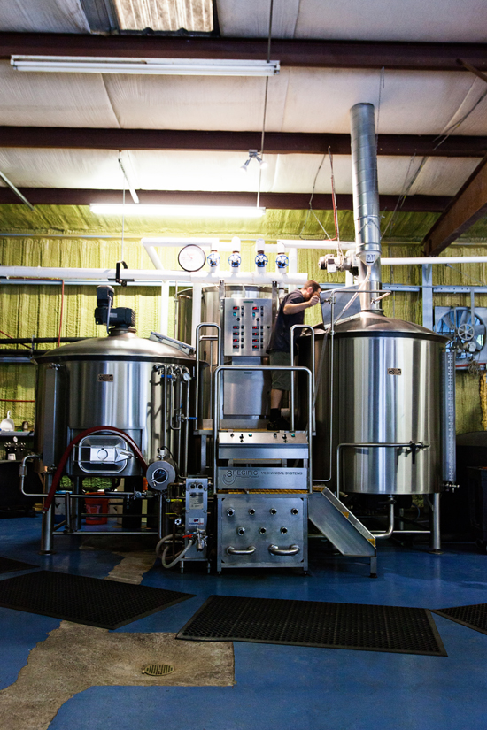 Chris Brown standing on top stands on top of Holy City&#039;s 15 bbl Brewhouse