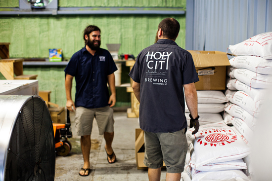 Tim Bettencourt and Chris Brown load grain for the next days brew.
