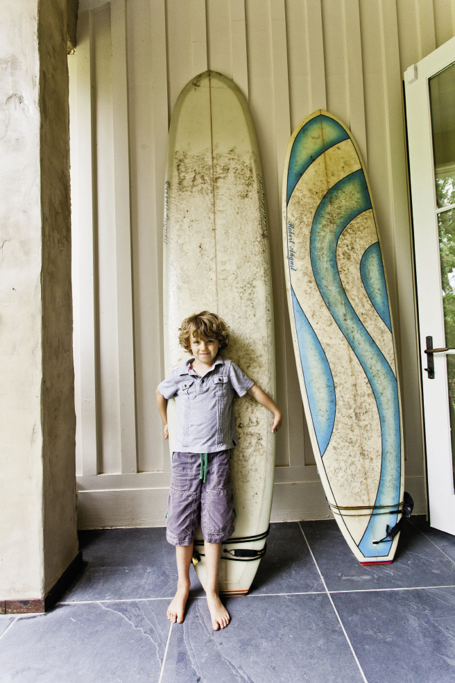 Sometime surf bum Max holds board meetings on the back steps