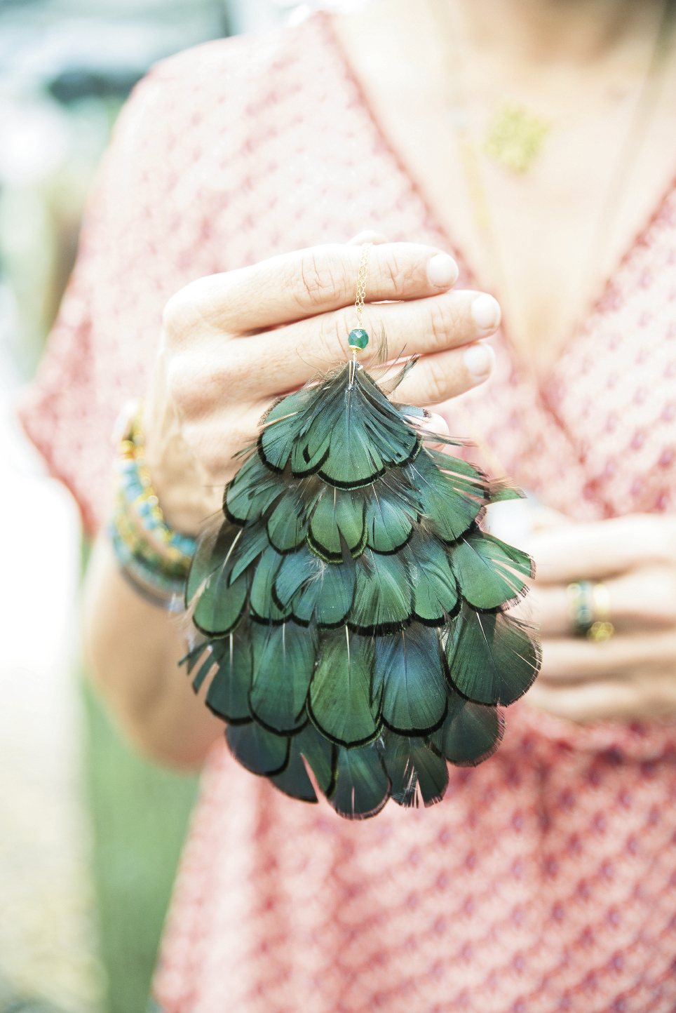 A peacock feather pendant from The Scarlet Poppy