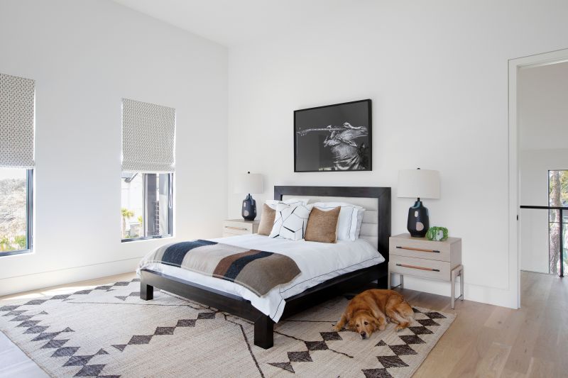 A Room of One’s Own: While the couples’ older children had (mostly) moved away by the time construction was complete, Erickson designed a room for each to match their interests. For the eldest son, there’s an international flavor, the large Lemieux Et Cie rug tying in a leather chair and drums that are out of frame.