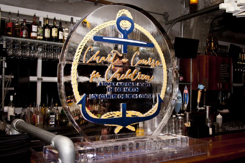 A large ice sculpture sat perched on the bar, commemorating the night&#039;s dinner auction and purpose.