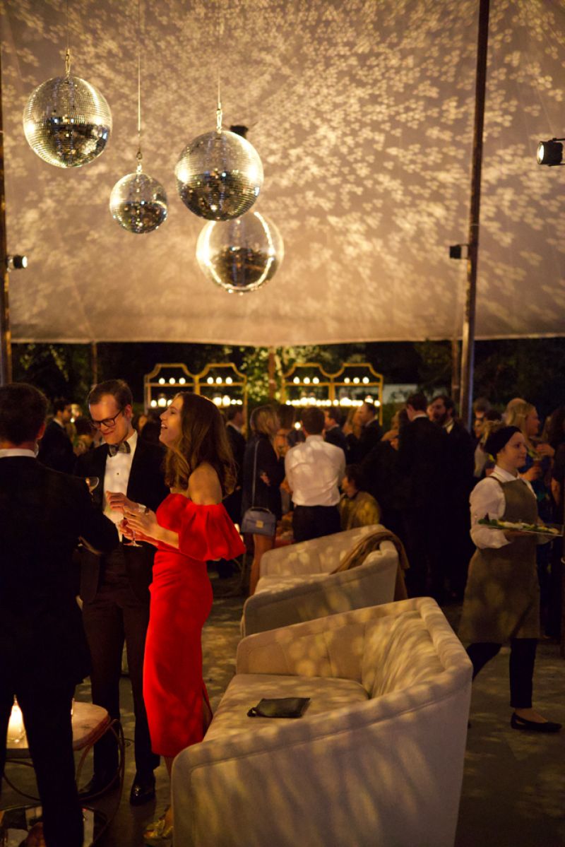 Guests mingle under disco balls in the Gibbes Museum of Art’s Lenhardt Garden.