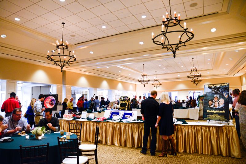 Guests grab a bite and consider auction items