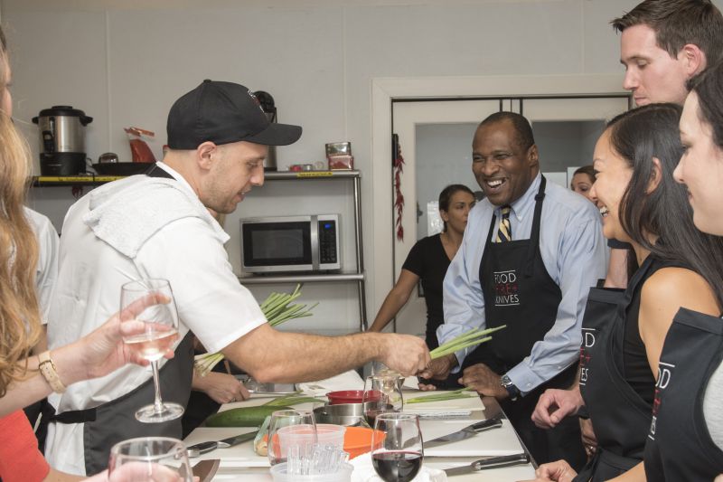 Chef Casciello passes out the scallions to chop for the GGS—garlic, ginger, and scallion—mixture.