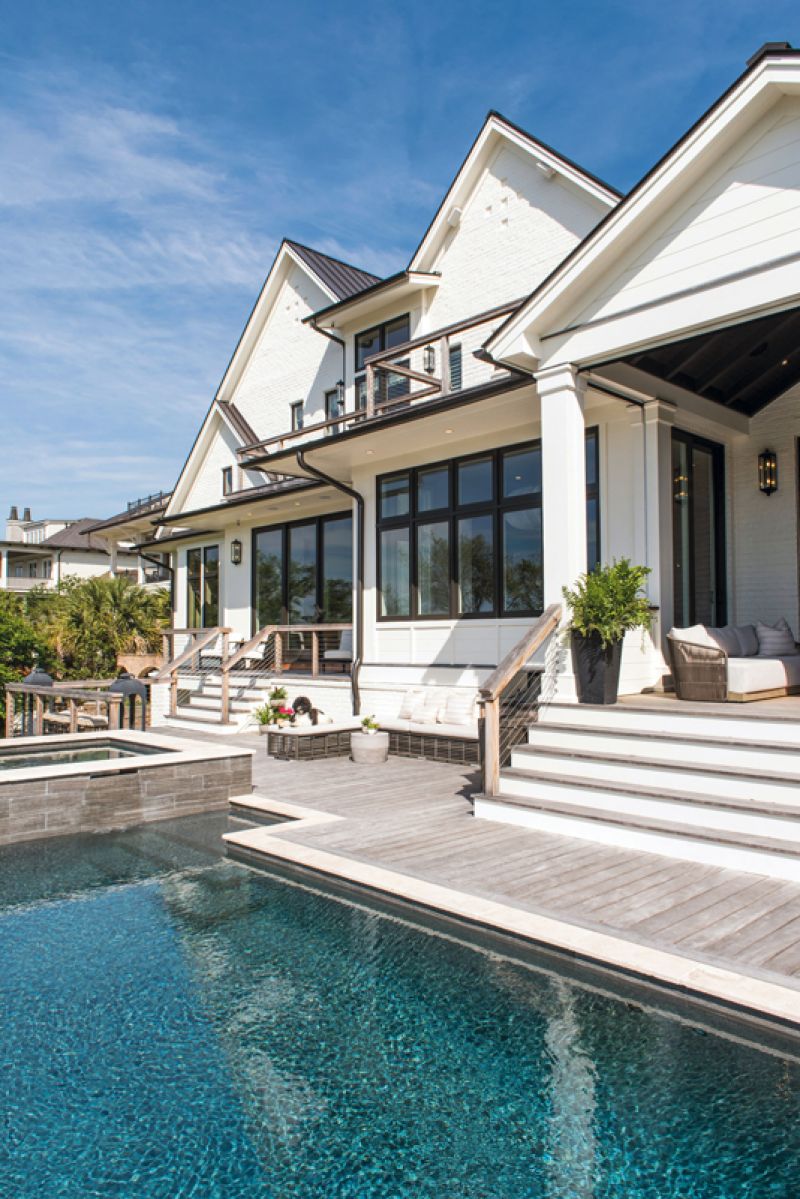 The back deck features planks of hardy, rot-resistant garapa, and the windows meet impact requirements for hurricane-force winds.