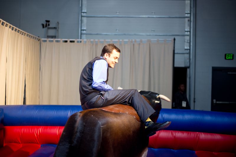Darrey Monroe tests his endurance riding the mechanical bull.