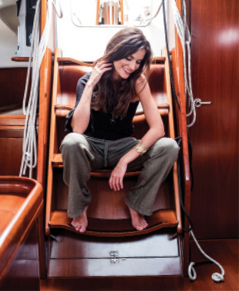 Rebecca Minkoff “Wappo” one-shoulder cotton and cashmere sweater, $158 at Beckett Boutique; Suzy D linen trousers in “khaki,” $88 at Lori + Lulu; David Yurman 18K yellow-gold “Osetra Long Station” pendant with black onyx, hematine, and rhodium on black silk cord necklace, $2,800 at REEDS Jewelers; Emilie Shapiro recycled brass cuff with raw-cut emeralds, $332 at Out of Hand
