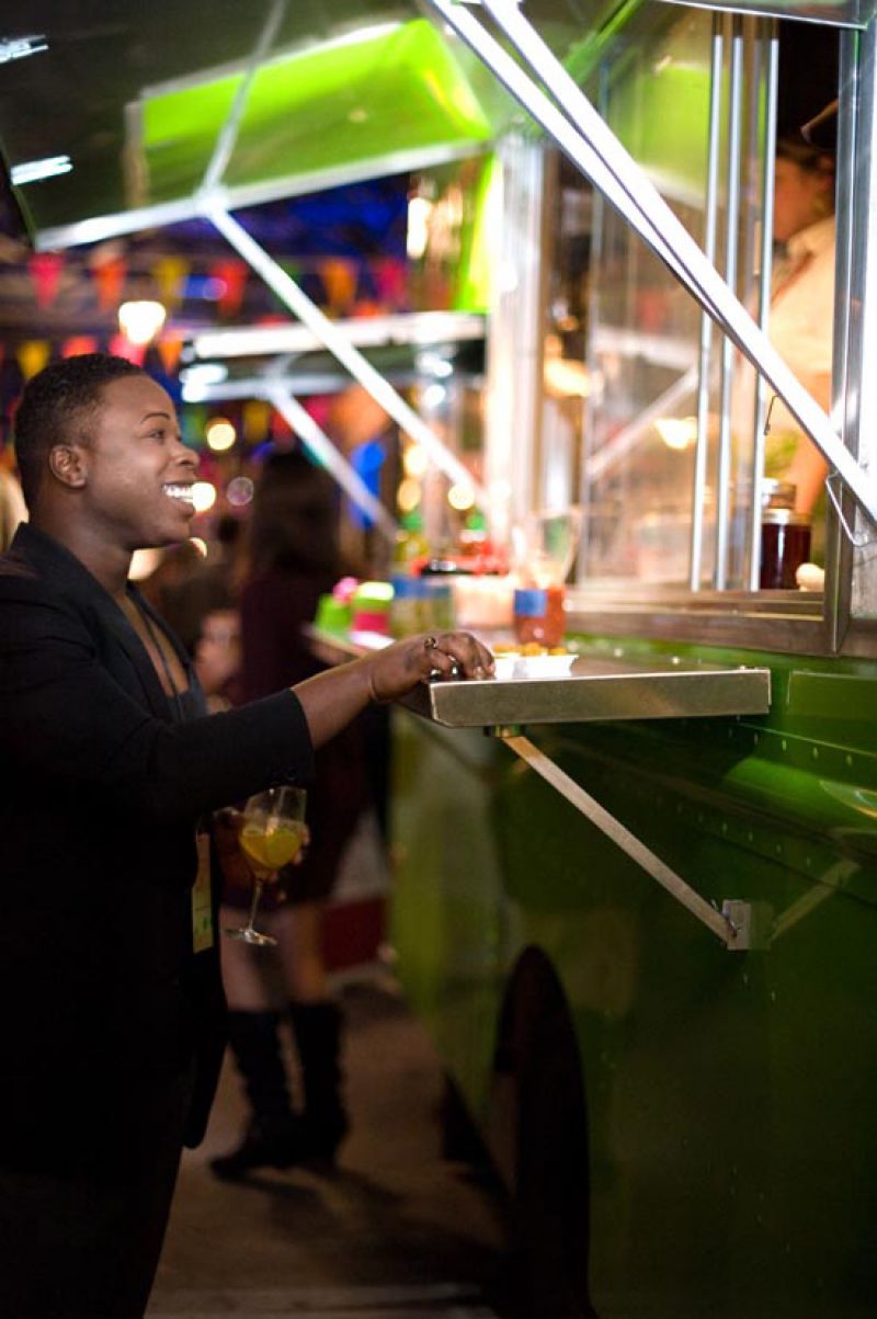 Demetrius Washington samples the Roti Rolls tasty fare