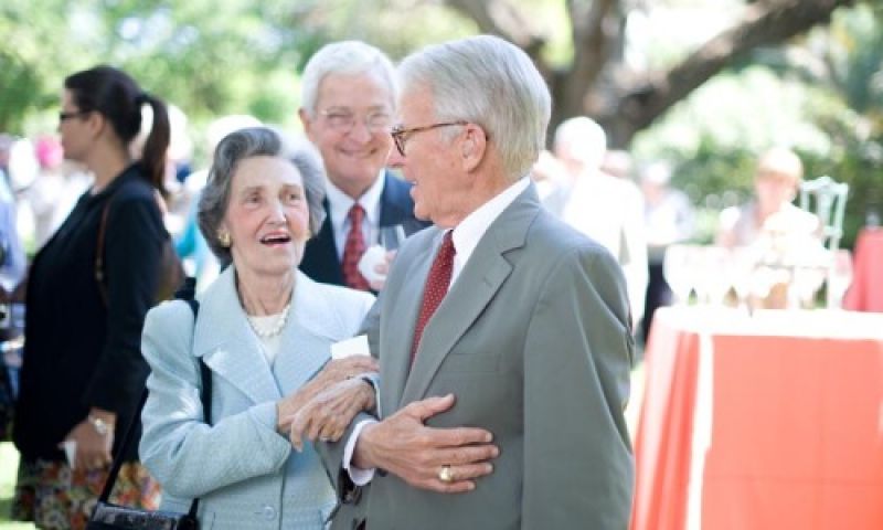 Mayor Joe Riley escorts Trudie Cooper into the luncheon