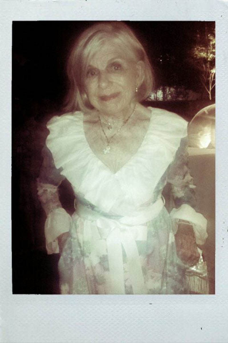 Peg Gum in a Hawaiian floral maxi dress.