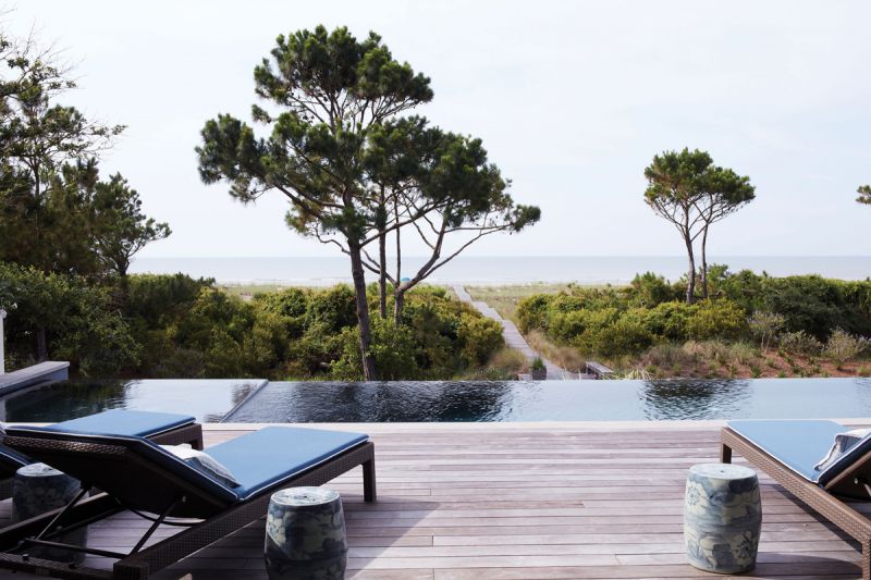 Ocean Influence: The central living room opens to a large deck that tapers off to an infinity pool and the Atlantic beyond.