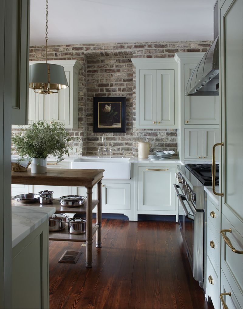 The Catalyst: The room that sparked the renovation, the kitchen was completely reconfigured to take it from serviceable to fresh and functional. Custom cabinets by F.M. Jessen Inc. in “Immersion” by C2 Paint, new appliances, and an open island make the space lighter, less cramped, and more usable for a modern family. An oil still life by Jonathan Koch highlights the original brick wall.