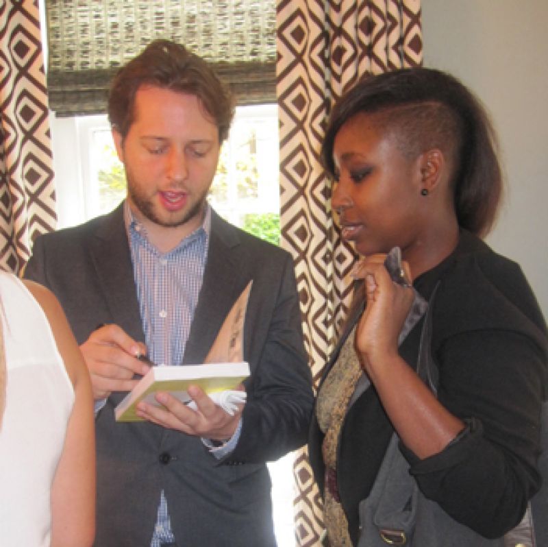 Derek signs his book for style director, Ayoka Lucas.