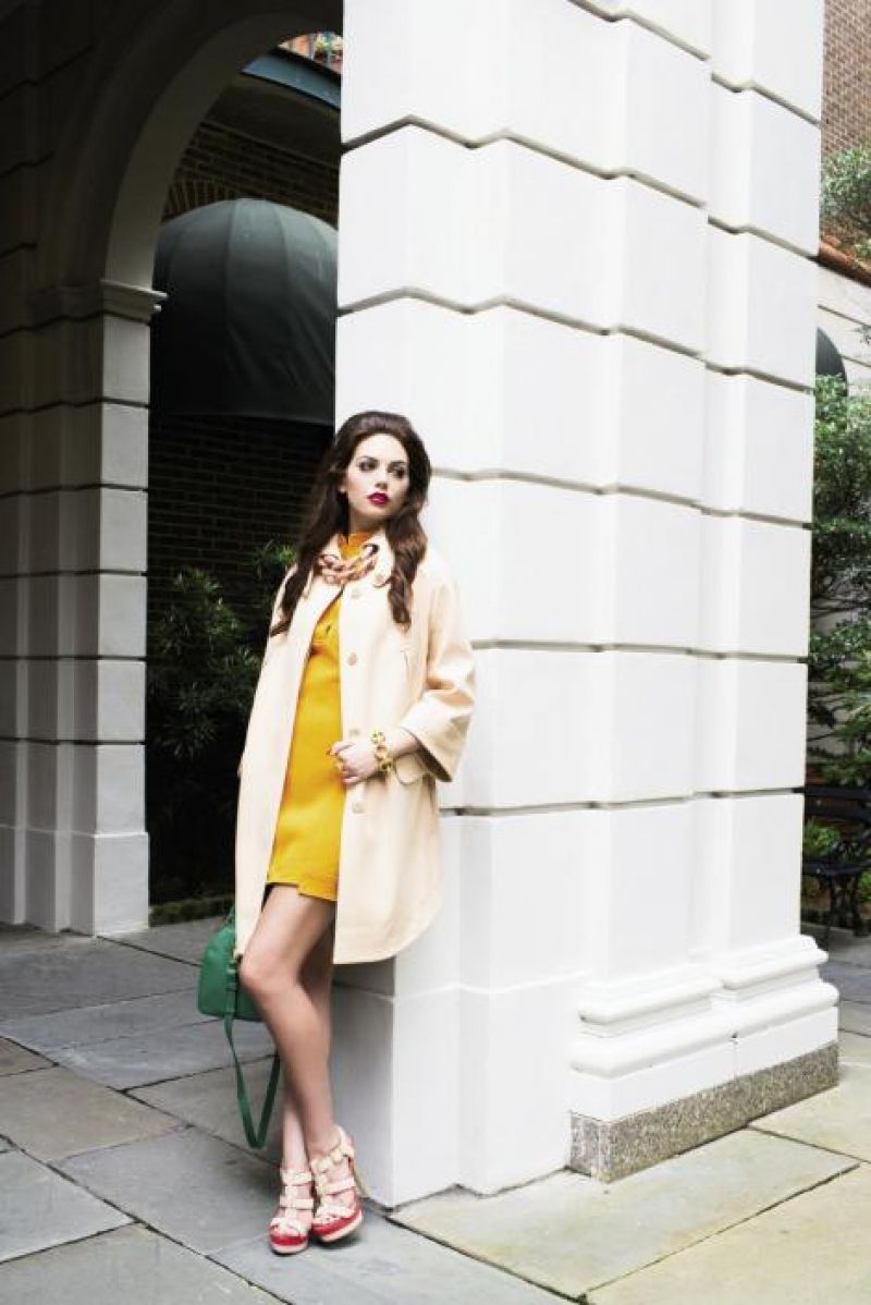 Tibi sleeveless sculpted techno knit dress, $450 at Copper Penny; Carven compact drape coat, $1,050 at Hampden Clothing; oversize chain-link necklace, price upon request at RTW; Saint Laurent Paris signature duffle with removable shoulder strap and key-ring pouch, $2,650 at Bob Ellis Shoes; “Dharinee” platform sandals, $90 at ALDO