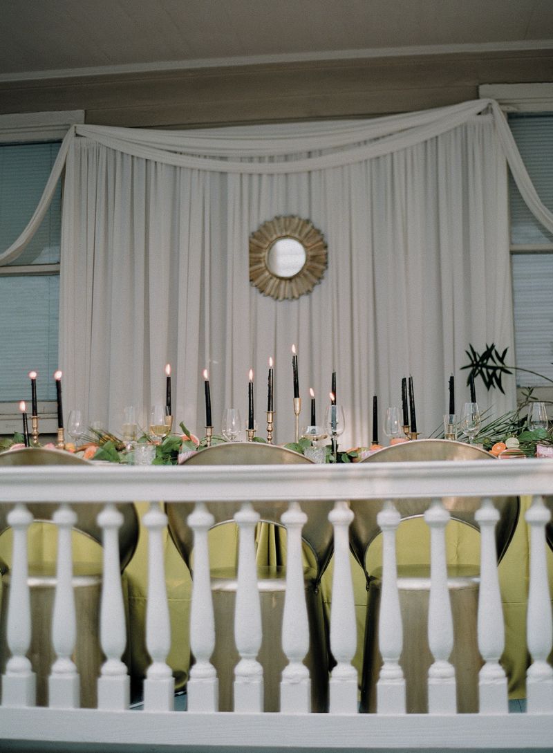 In addition to the fabric draped around the piazza, The Social Spool added a panel along the wall, creating a clean backdrop. “We knew that the table would have a lot of dynamic interest so we needed to simplify the surroundings,” says Reagan.